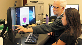AccessCSforAll PI Richard Landner shows a student how to use Quorum