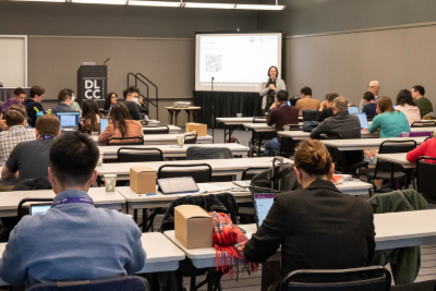 Symposium attendees in a classroom